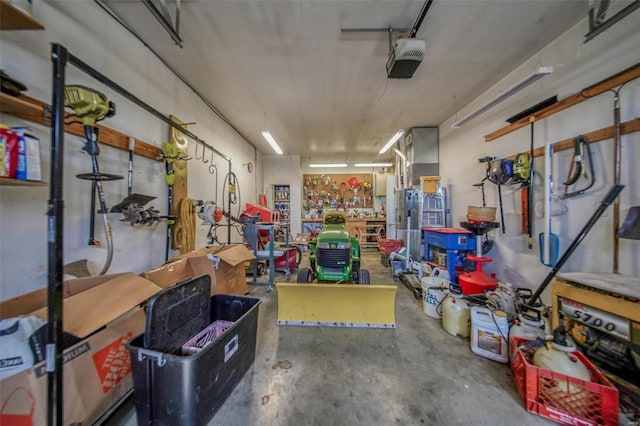 garage with a workshop area and a garage door opener