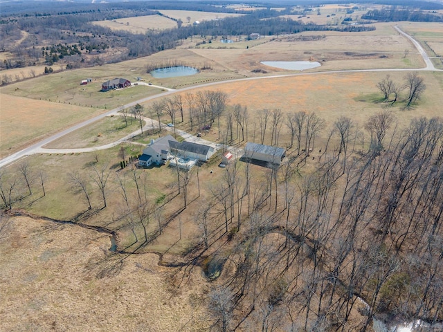 birds eye view of property with a rural view and a water view