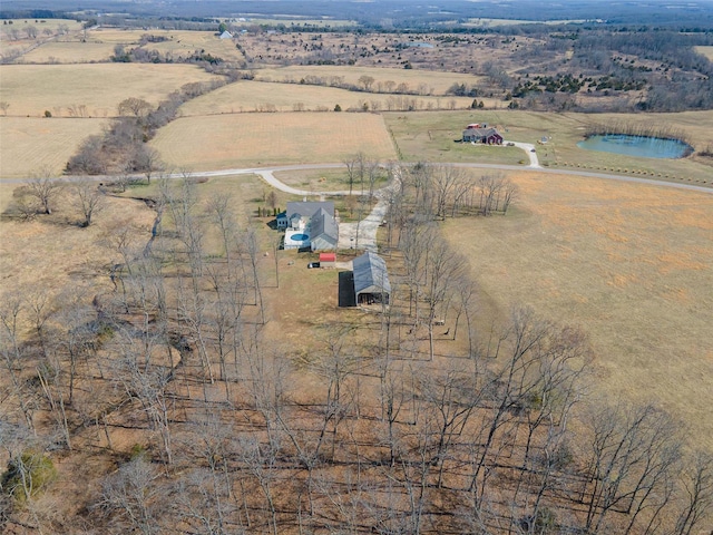 birds eye view of property with a rural view