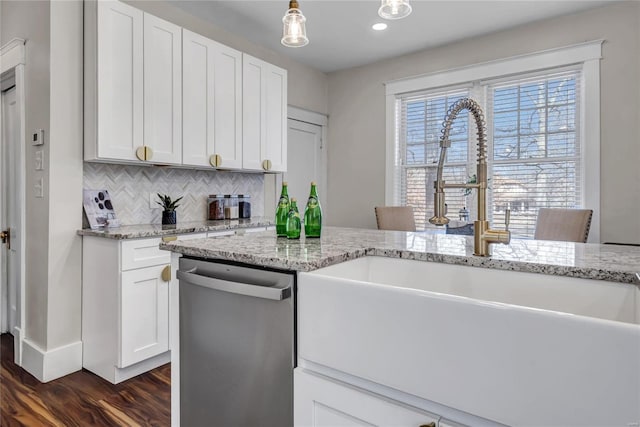 kitchen with decorative backsplash, stainless steel dishwasher, dark wood-style floors, white cabinets, and a sink