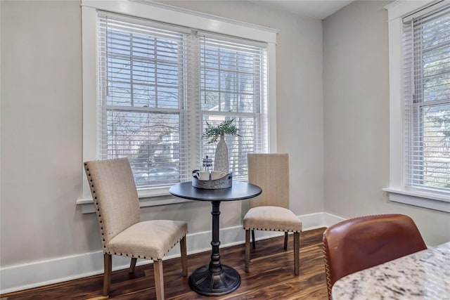 dining area with wood finished floors and baseboards