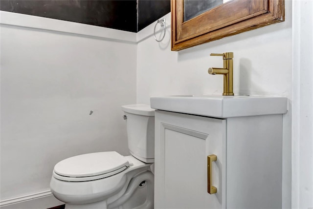 bathroom with toilet and vanity