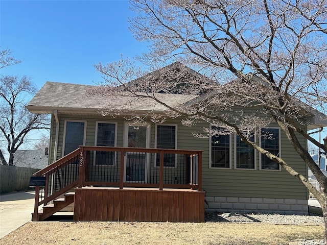 bungalow-style house featuring covered porch and roof with shingles