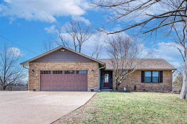 ranch-style house featuring a front yard, roof with shingles, an attached garage, concrete driveway, and brick siding