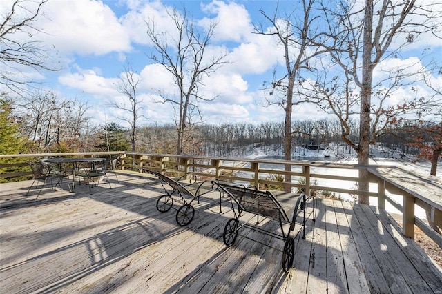 wooden deck with outdoor dining area