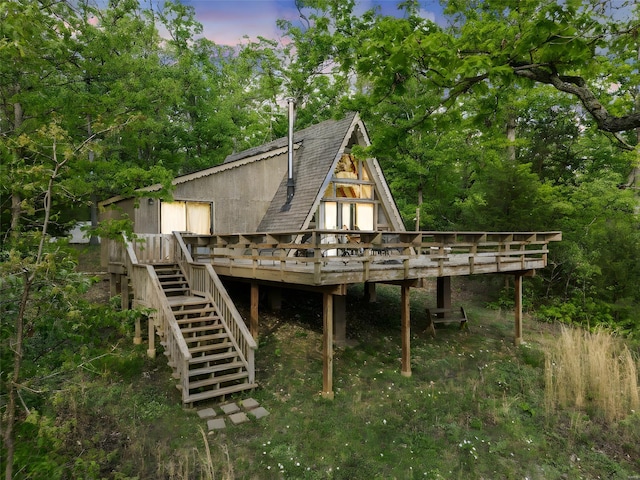 view of outbuilding featuring stairs