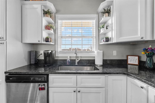 kitchen featuring open shelves, dark stone counters, stainless steel dishwasher, white cabinetry, and a sink