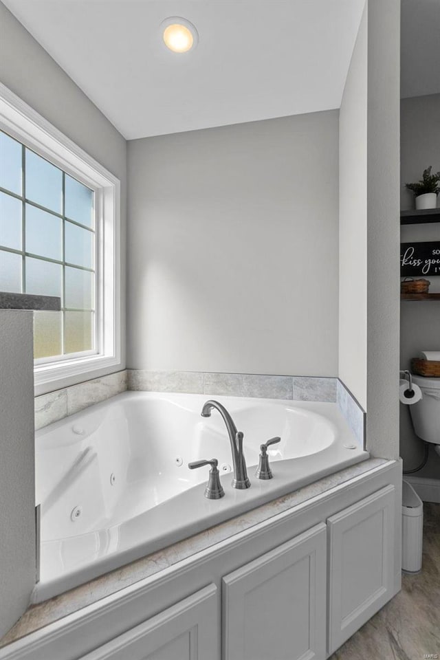 bathroom with a whirlpool tub