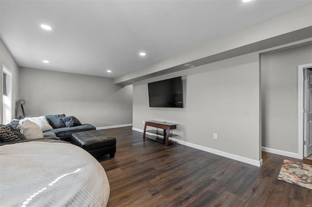 bedroom featuring dark wood-style floors, recessed lighting, and baseboards