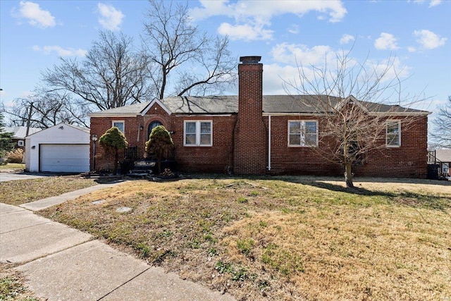 ranch-style house with brick siding, an outdoor structure, and a front lawn