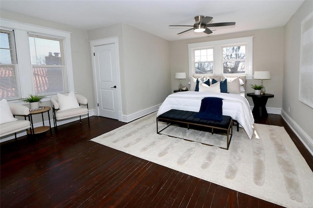 bedroom with baseboards, hardwood / wood-style floors, and a ceiling fan