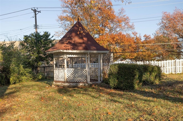 view of outbuilding with a gazebo and fence