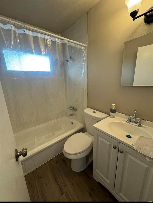 bathroom with vanity, shower / bath combination with curtain, toilet, and wood finished floors