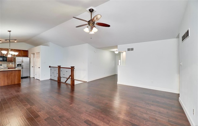 unfurnished living room with visible vents, baseboards, dark wood finished floors, lofted ceiling, and ceiling fan with notable chandelier