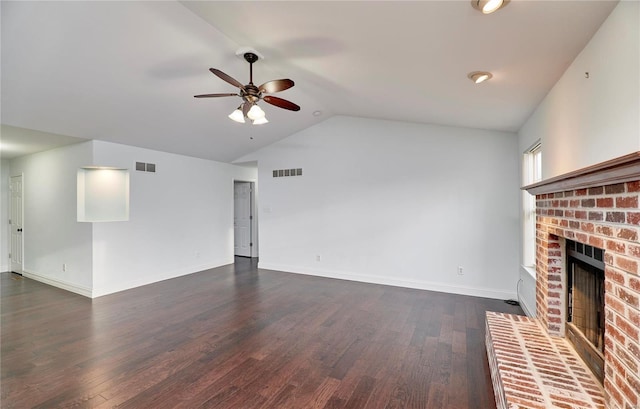 unfurnished living room featuring visible vents, ceiling fan, lofted ceiling, a fireplace, and dark wood-style flooring