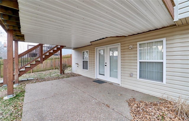 view of patio with stairway, fence, and french doors