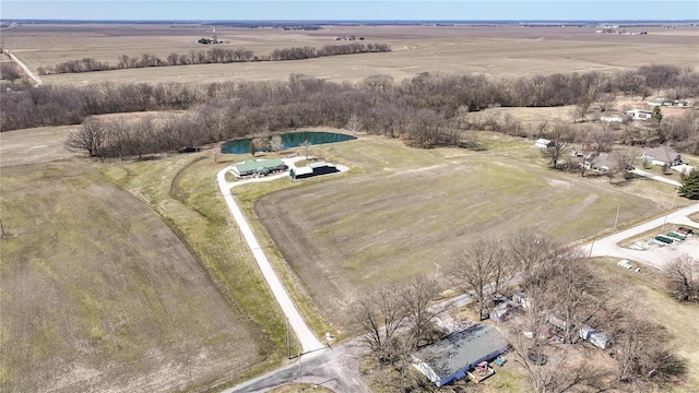 birds eye view of property with a rural view