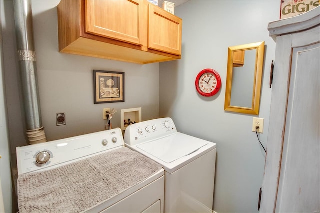 laundry room with cabinet space and washer and clothes dryer