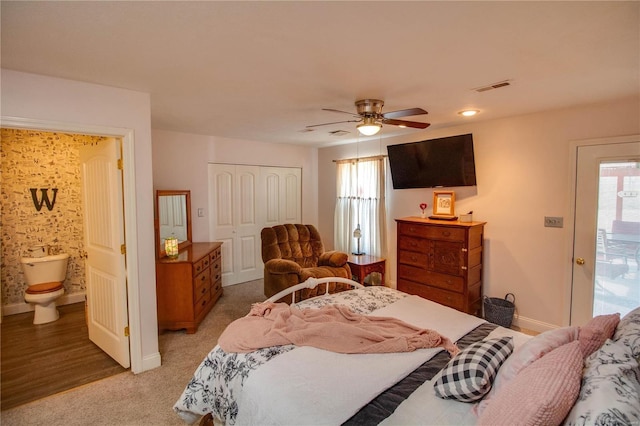 bedroom featuring multiple windows, baseboards, visible vents, and a closet