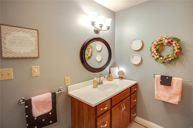 bathroom featuring baseboards and vanity