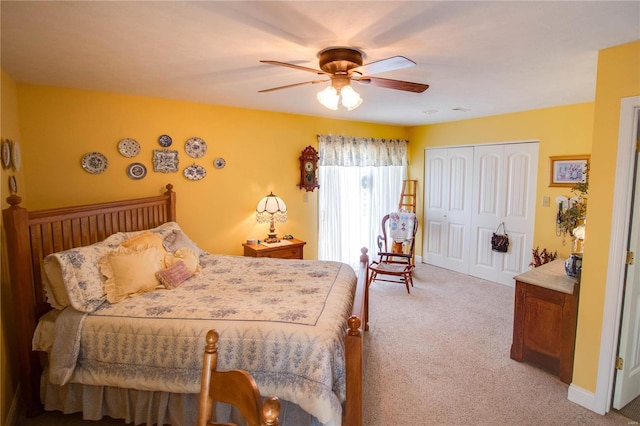 bedroom with light carpet, a ceiling fan, and a closet