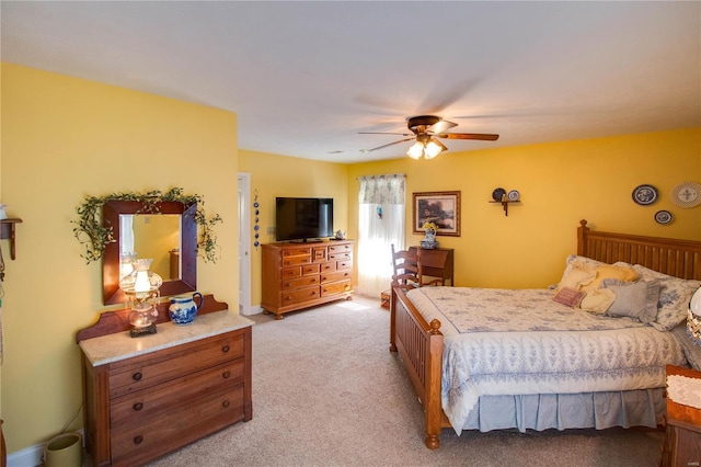 bedroom with light colored carpet and a ceiling fan