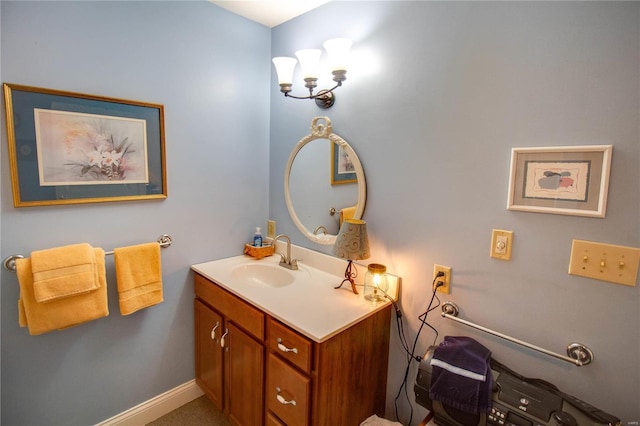 bathroom with vanity and baseboards