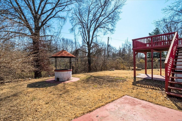 view of yard with stairway and a wooden deck