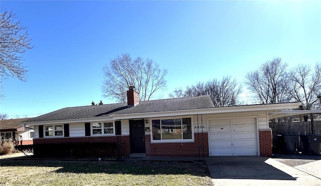 ranch-style home with brick siding, fence, a chimney, driveway, and an attached garage