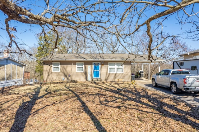 ranch-style home with a carport