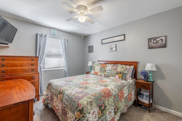 carpeted bedroom featuring baseboards and ceiling fan