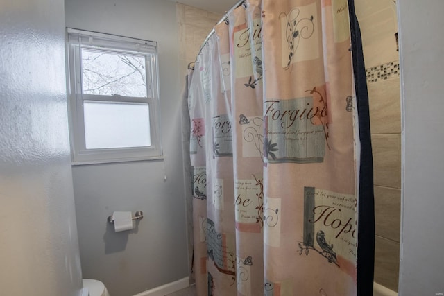 bathroom with curtained shower