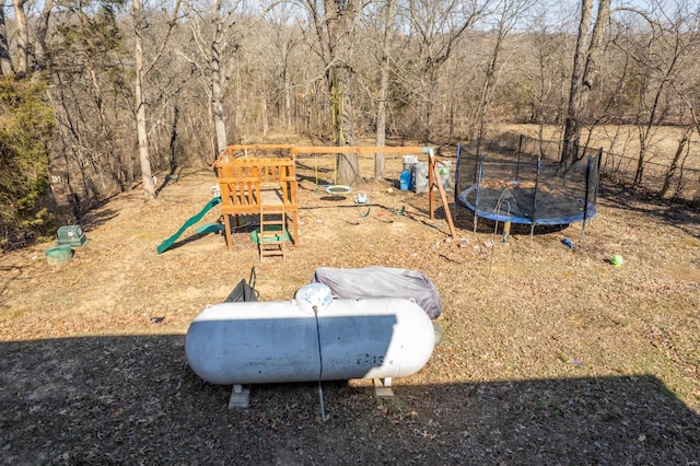 exterior space with a playground and a trampoline