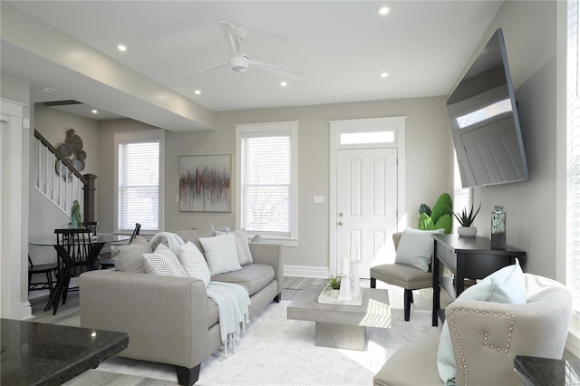 living room with light wood finished floors, recessed lighting, stairs, and ceiling fan