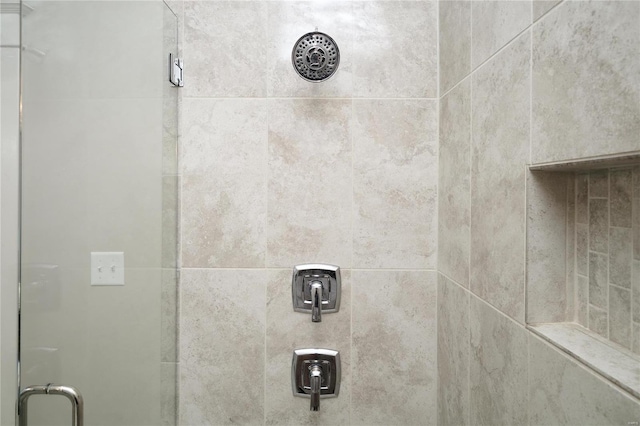 room details with a tile shower