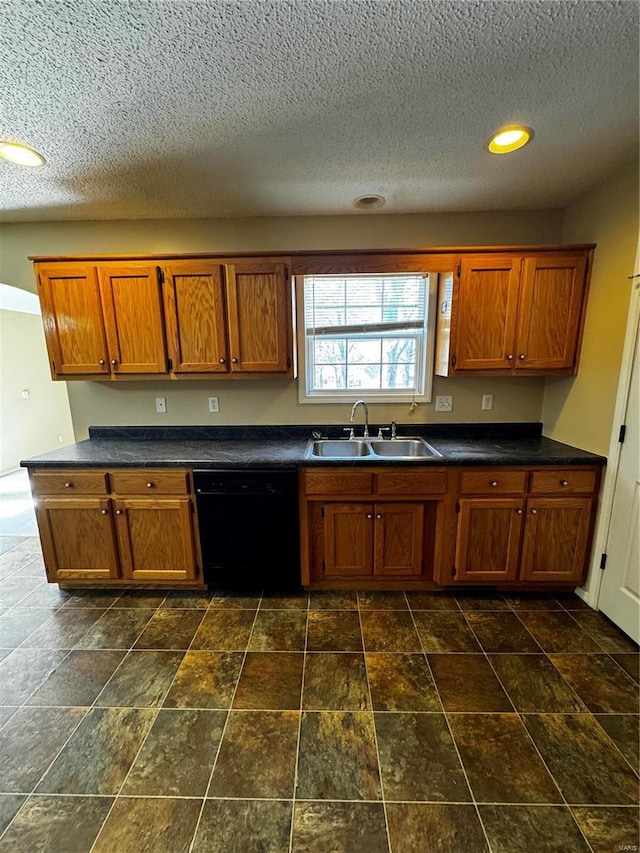 kitchen with black dishwasher, brown cabinets, and a sink