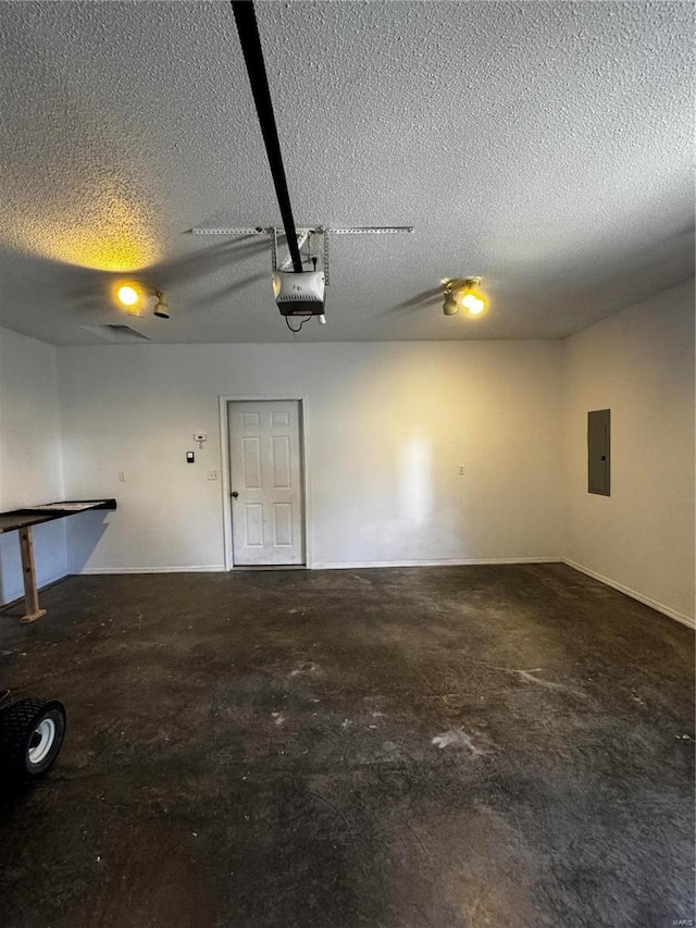 garage featuring electric panel and a garage door opener