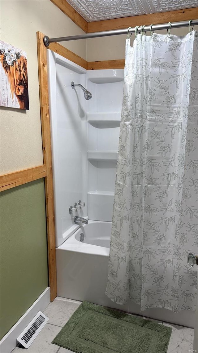 bathroom with visible vents, marble finish floor, and shower / tub combo