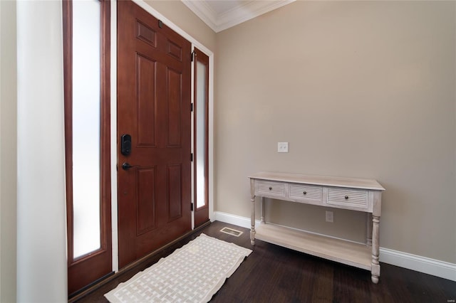 foyer entrance with dark wood-style flooring, baseboards, and ornamental molding