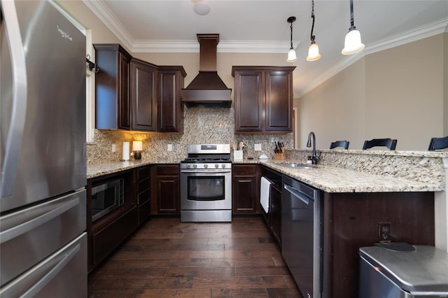 kitchen featuring dark wood-style floors, premium range hood, a sink, stainless steel appliances, and dark brown cabinets