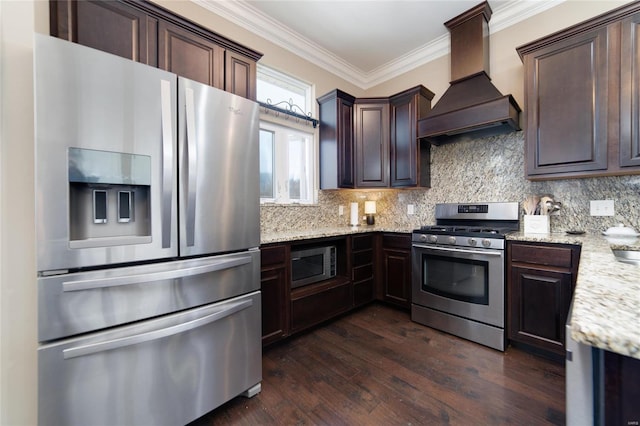 kitchen with custom exhaust hood, backsplash, stainless steel appliances, and ornamental molding