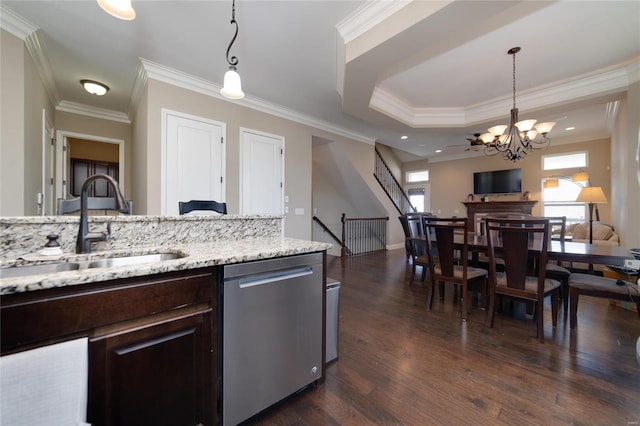 kitchen with dark wood-style floors, a sink, hanging light fixtures, dark brown cabinetry, and dishwasher