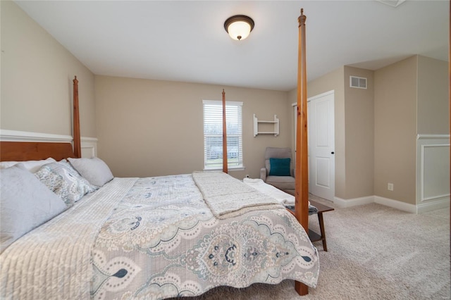 bedroom with visible vents, baseboards, and carpet