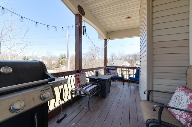 wooden terrace featuring grilling area