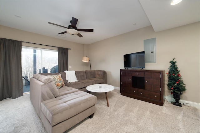 carpeted living room with electric panel, ceiling fan, and baseboards