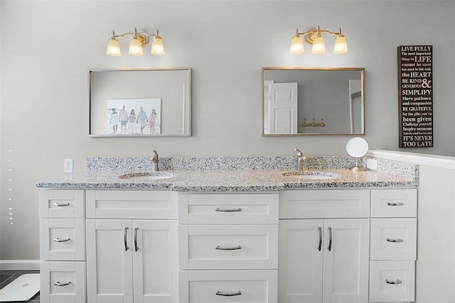 full bath featuring double vanity and a sink