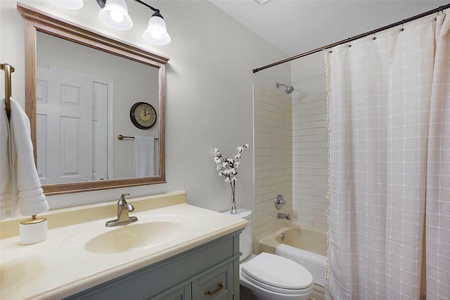 bathroom featuring vanity, toilet, and shower / bath combo