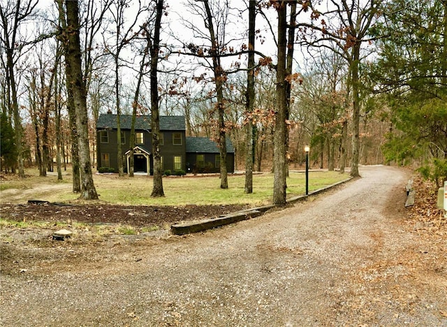 view of front of property with driveway and a front yard