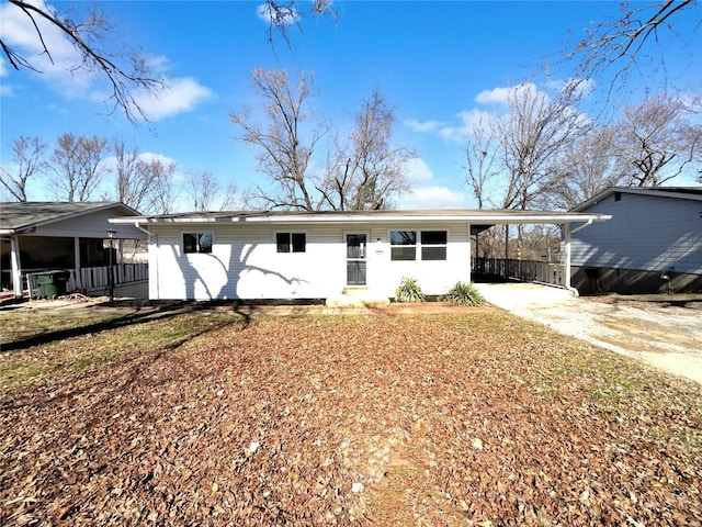 view of front of home with an attached carport and driveway