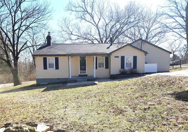 ranch-style home featuring a front lawn, crawl space, and a chimney